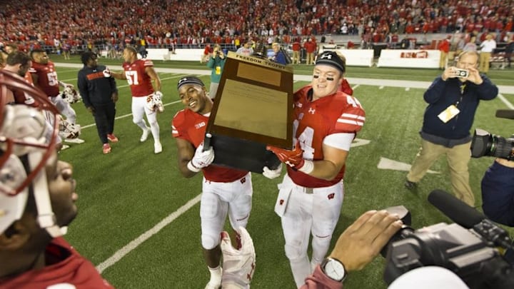 Oct 29, 2016; Madison, WI, USA; Wisconsin Badgers running back Corey Clement (6) and tight end Eric Steffes (44) lift the Freedom Trophy following the game against the Nebraska Cornhuskers at Camp Randall Stadium. Wisconsin won 23-17. Mandatory Credit: Jeff Hanisch-USA TODAY Sports
