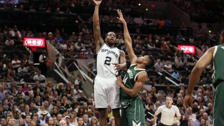 Dec 2, 2015; San Antonio, TX, USA; San Antonio Spurs small forward Kawhi Leonard (2) shoots the ball over Milwaukee Bucks small forward Giannis Antetokounmpo (34) during the first half at AT&T Center. Mandatory Credit: Soobum Im-USA TODAY Sports