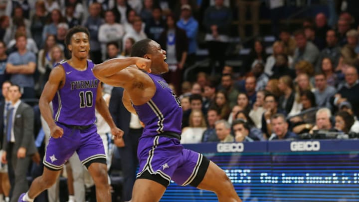 VILLANOVA, PA - NOVEMBER 17: Jordan Lyons #23 and Alex Hunter #10 of the Furman Paladins celebrate after defeating the Villanova Wildcats 76-68 in overtime at Finneran Pavilion on November 17, 2018 in Villanova, Pennsylvania. (Photo by Rich Schultz/Getty Images)