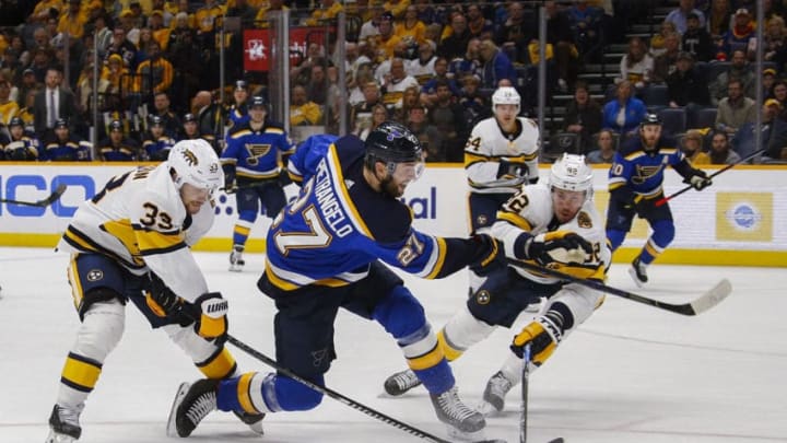 NASHVILLE, TENNESSEE - FEBRUARY 16: Alex Pietrangelo #27 of the St. Louis Blues takes a shot past Ryan Johansen #92 of the Nashville Predators during the second period at Bridgestone Arena on February 16, 2020 in Nashville, Tennessee. (Photo by Frederick Breedon/Getty Images)