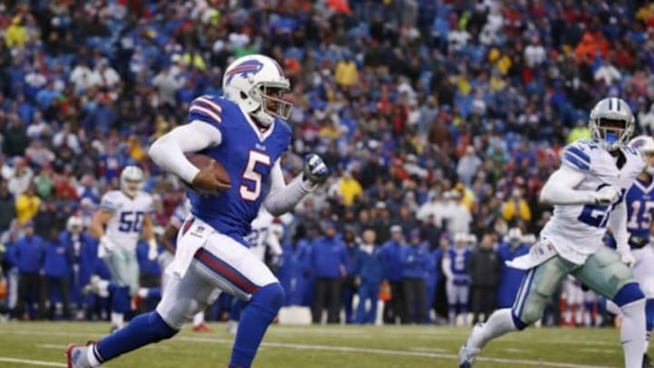 Dec 27, 2015; Orchard Park, NY, USA; Buffalo Bills quarterback Tyrod Taylor (5) runs with the ball for a first down during the second half against the Dallas Cowboys at Ralph Wilson Stadium. The Bills defeat Cowboys 16-6. Mandatory Credit: Kevin Hoffman-USA TODAY Sports