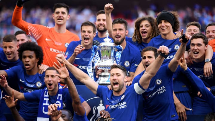 LONDON, ENGLAND - MAY 19: Olivier Giroud of Chelsea holds the Emirates FA Cup trophy in celebration of his side's win, with team mates following The Emirates FA Cup Final between Chelsea and Manchester United at Wembley Stadium on May 19, 2018 in London, England. (Photo by Laurence Griffiths/Getty Images)