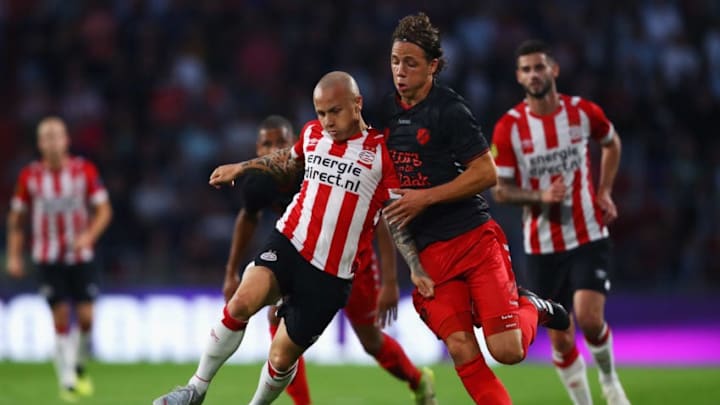 EINDHOVEN, NETHERLANDS - AUGUST 11: Jose Angel Esmoris Tasende Angelino of PSV battles for the ball with Giovanni Troupee of FC Utrecht during the Eredivisie match between PSV and Utrecht at Philips Stadion on August 11, 2018 in Eindhoven, Netherlands. (Photo by Dean Mouhtaropoulos/Getty Images)