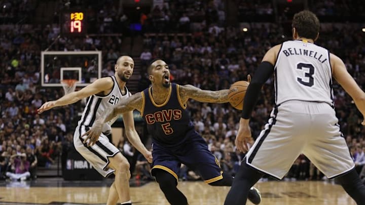 Mar 12, 2015; San Antonio, TX, USA; Cleveland Cavaliers guard J.R. Smith (5) is fouled by San Antonio Spurs shooting guard Manu Ginobili (20) during the second half at AT&T Center. Mandatory Credit: Soobum Im-USA TODAY Sports