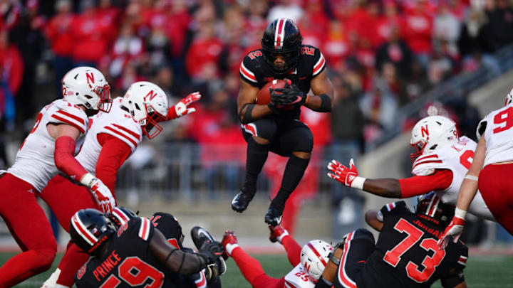 COLUMBUS, OH - NOVEMBER 3: J.K. Dobbins #2 of the Ohio State Buckeyes leaps over blockers and would be tacklers to pick up yardage in the fourth quarter against the Nebraska Cornhuskers at Ohio Stadium on November 3, 2018 in Columbus, Ohio. Ohio State defeated Nebraska 36-31. (Photo by Jamie Sabau/Getty Images)