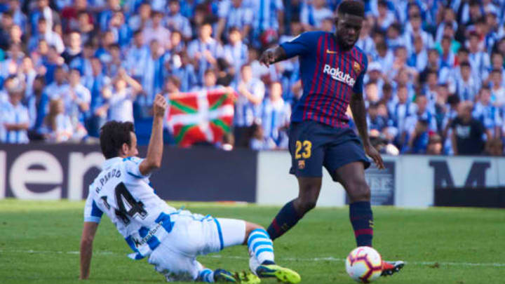 SAN SEBASTIAN, – SEPTEMBER 15: Samuel Umtiti, defender of FC Barcelona competes for the ball with Ruben Pardo, midfielder of Real Sociedad during the La Liga match between Real Sociedad and FC Barcelona at Anoeta Stadium on September 15, 2018, in San Sebastian, Spain. (Photo by Carlos Sanchez Martinez/Icon Sportswire via Getty Images)