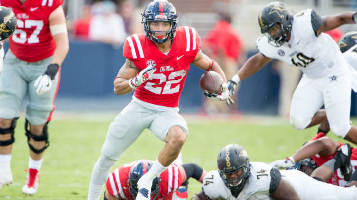 OXFORD, MS - OCTOBER 14: Running back Jordan Wilkins #22 of the Mississippi Rebels runs the ball after escaping a tackle by defensive lineman Jay Woods #74 of the Vanderbilt Commodores at Vaught-Hemingway Stadium on October 14, 2017 in Oxford, Mississippi. (Photo by Michael Chang/Getty Images)
