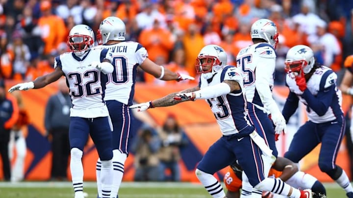 Jan 24, 2016; Denver, CO, USA; New England Patriots defensive back Devin McCourty (32) and safety Patrick Chung (23) celebrate a play against the Denver Broncos in the AFC Championship football game at Sports Authority Field at Mile High. Mandatory Credit: Mark J. Rebilas-USA TODAY Sports