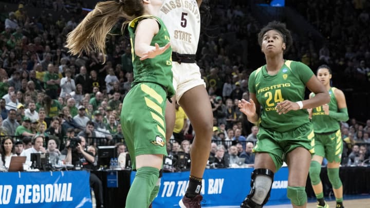PORTLAND, OR – MARCH 31: Mississippi State Bulldogs forward Anriel Howard (5) shoots a basket against Oregon Ducks guard Sabrina Ionescu (20) during the NCAA Division I Women’s Championship Elite Eight round basketball game between the Oregon Ducks and Mississippi State Bulldogs on March 31, 2019 at Moda Center in Portland, Oregon. (Photo by Joseph Weiser/Icon Sportswire via Getty Images)