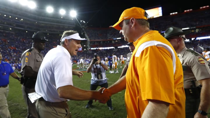 Sep 25, 2021; Gainesville, Florida, USA; Florida Gators head coach Dan Mullen and Tennessee Volunteers head coach Josh Heupel greet after the game at Ben Hill Griffin Stadium. Mandatory Credit: Kim Klement-USA TODAY Sports