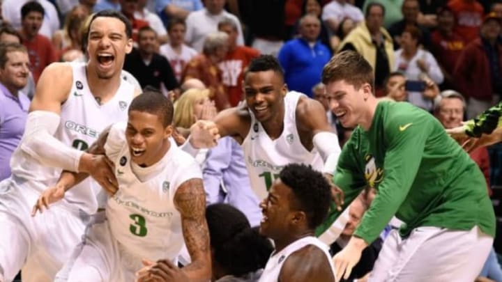 March 13, 2015; Las Vegas, NV, USA; Oregon Ducks guard Joseph Young (3) is congratulated after making the game-winning three-point basket against the Utah Utes after the game in the semifinal round of the Pac-12 Conference tournament at MGM Grand Garden Arena. The Ducks defeated the Utes 67-64. Mandatory Credit: Kyle Terada-USA TODAY Sports