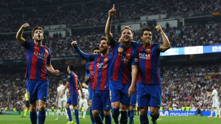 MADRID, SPAIN - APRIL 23: Ivan Rakitic of Barcelona (2R) celebrates as he scores their second goal with team mates Sergi Roberto, Lionel Messi and Luis Suarez during the La Liga match between Real Madrid CF and FC Barcelona at Estadio Bernabeu on April 23, 2017 in Madrid, Spain. (Photo by David Ramos/Getty Images)