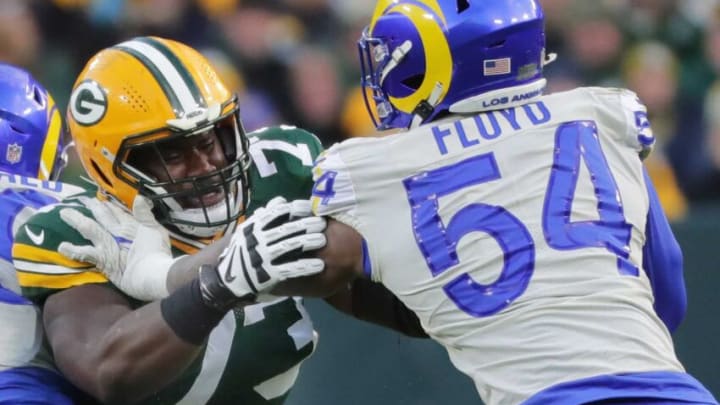 Green Bay Packers offensive tackle Yosh Nijman (73) blocks Los Angeles Rams outside linebacker Leonard Floyd (54) during the first quarter of their game Sunday, November 28, 2021 at Lambeau Field in Green Bay, Wis.n the Green Bay Packers beat the Los Angeles Rams 36-28.Packers29 14