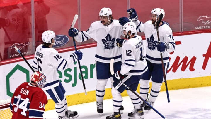 Apr 12, 2021; Montreal, Quebec, CAN; Toronto Maple Leafs center Auston Matthews (34) celebrates his goal against Montreal Canadiens goaltender Jake Allen (34) with teammates during the second period at Bell Centre. Mandatory Credit: Jean-Yves Ahern-USA TODAY Sports