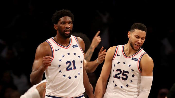 NEW YORK, NEW YORK – APRIL 20: Joel Embiid #21 and Ben Simmons #25 of the Philadelphia 76ers celebrate the win over the Brooklyn Nets at Barclays Center on April 20, 2019 in the Brooklyn borough of New York City.The Philadelphia 76ers defeated the Brooklyn Nets 112-108. NOTE TO USER: User expressly acknowledges and agrees that, by downloading and or using this photograph, User is consenting to the terms and conditions of the Getty Images License Agreement. (Photo by Elsa/Getty Images)