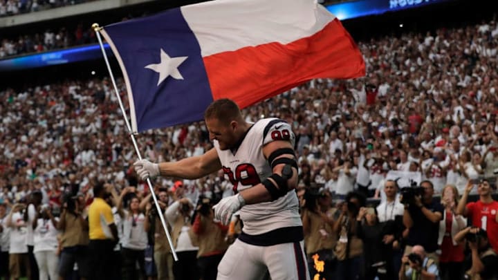 HOUSTON, TX - SEPTEMBER 10: J.J. Watt #99 of the Houston Texans enters the field with Texas flag against the Jacksonville Jaguars at NRG Stadium on September 10, 2017 in Houston, Texas. (Photo by Tim Warner/Getty Images)