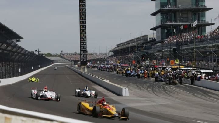 May 27, 2016; Indianapolis, IN, USA; Verizon Indy Car driver Ryan Hunter-Reay leads a pack of cars down the front straightaway during Carb Day for the Indianapolis 500 at Indianapolis Motor Speedway. Mandatory Credit: Brian Spurlock-USA TODAY Sports