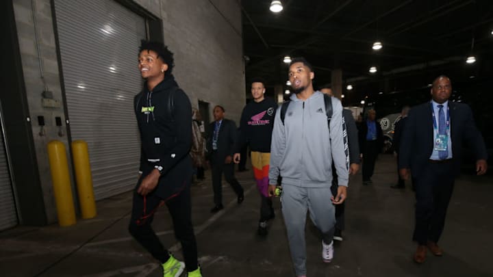 CHARLOTTE, NC - FEBRUARY 15: De'Aaron Fox #5 and Donovan Mitchell #45 of the U.S. Team arrive prior to the 2019 Mtn Dew ICE Rising Stars Game on February 15, 2019 at the Spectrum Center in Charlotte, North Carolina. NOTE TO USER: User expressly acknowledges and agrees that, by downloading and/or using this photograph, user is consenting to the terms and conditions of the Getty Images License Agreement. Mandatory Copyright Notice: Copyright 2019 NBAE (Photo by David Sherman/NBAE via Getty Images)