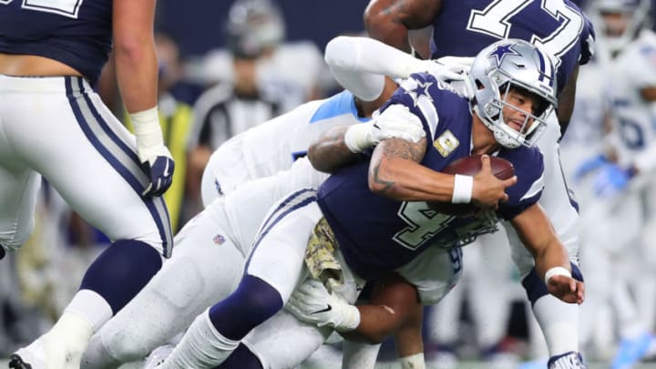 ARLINGTON, TX - NOVEMBER 05: Dak Prescott #4 of the Dallas Cowboys is brought down by the Tennessee Titans in the second half of a football game at AT&T Stadium on November 5, 2018 in Arlington, Texas. (Photo by Tom Pennington/Getty Images)