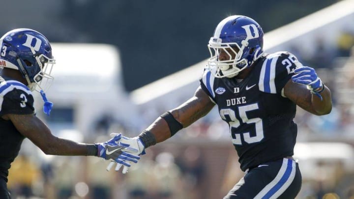 Oct 29, 2016; Atlanta, GA, USA; Duke Blue Devils running back Jela Duncan (25) celebrates a touchdown with wide receiver T.J. Rahming (3) against the Georgia Tech Yellow Jackets in the third quarter at Bobby Dodd Stadium. Mandatory Credit: Brett Davis-USA TODAY Sports