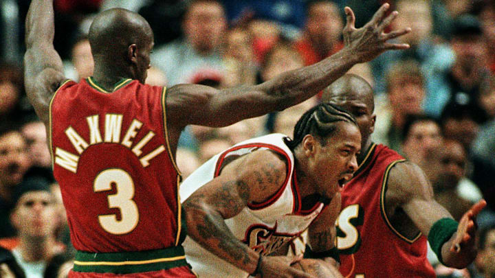 PHILADELPHIA, : The Philadelphia 76ers’ Allen Iverson (C) is surrounded by the Seattle SuperSonics’ Vernon Maxwell (3) and Ruben Patterson as he looks to pass in the second period 08 November 1999. The 76ers won their first game of the season defeating the Sonics 117-98. Iverson scored 37 points, 9 rebounds and had 3 assists. AFP PHOTO/ TOM MIHALEK (Photo credit should read TOM MIHALEK/AFP via Getty Images)