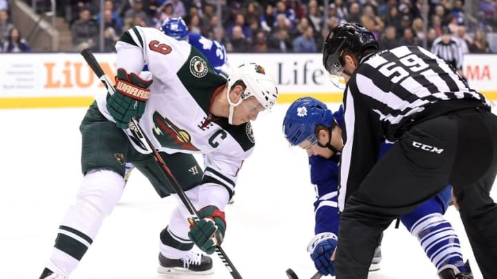 Mar 3, 2016; Toronto, Ontario, CAN; Minnesota Wild center Mikko Koivu (9) takes a faceoff against Toronto Maple Leafs center William Nylander (39) in the second period at Air Canada Centre. Mandatory Credit: Dan Hamilton-USA TODAY Sports