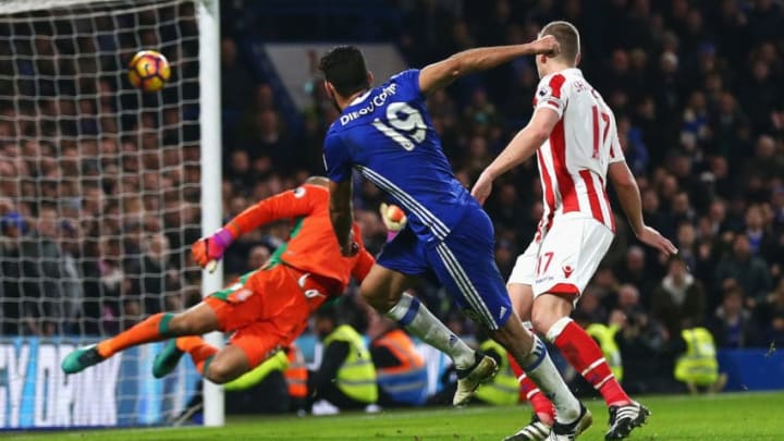 LONDON, ENGLAND - DECEMBER 31: Diego Costa (C) of Chelsea scores his side's fourth goal past Lee Grant of Stoke City during the Premier League match between Chelsea and Stoke City at Stamford Bridge on December 31, 2016 in London, England. (Photo by Steve Bardens/Getty Images)