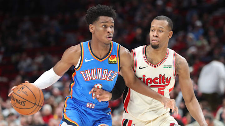 Shai Gilgeous-Alexander #2 of the OKC Thunder dribbles against Rodney Hood #5 of the Portland Trail Blazers in the third quarter during their game (Photo by Abbie Parr/Getty Images)