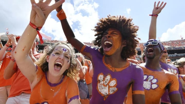 CLEMSON, SC - SEPTEMBER 01: Clemson Tigers fans raise four fingers prior to the start of the fourth quarter of the Tigers' football game against the Furman Paladins at Clemson Memorial Stadium on September 1, 2018 in Clemson, South Carolina. (Photo by Mike Comer/Getty Images)