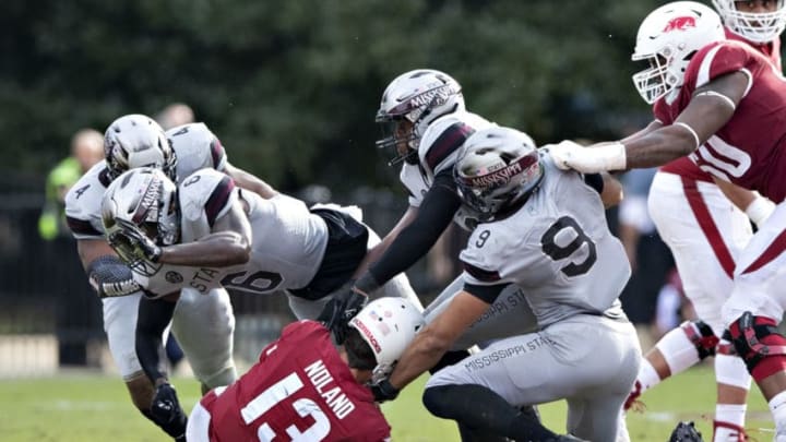 STARKVILLE, MS - NOVEMBER 17: Connor Noland #13 of the Arkansas Razorbacks is sacked in the second half of a game by Montez Sweat #9 and Willie Gay Jr. #6 of the Mississippi State Bulldogs at Davis Wade Stadium on November 17, 2018 in Starkville, Mississippi. The Bulldogs defeated the Razorbacks 52-6. (Photo by Wesley Hitt/Getty Images)