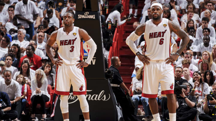 MIAMI, FL – JUNE 17: Dwyane Wade #3 and LeBron James #6 of the Miami Heat wait to resume action against the Oklahoma City Thunder in Game Three of the 2012 NBA Finals at American Airlines Arena on June 17, 2012 in Miami, Florida. NOTE TO USER: User expressly acknowledges and agrees that, by downloading and or using this photograph, user is consenting to the terms and conditions of the Getty Images License Agreement. Mandatory Copyright Notice: Copyright 2012 NBAE (Photo by Andrew D. Bernstein/NBAE via Getty Images)