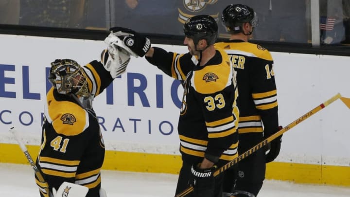 BOSTON - NOVEMBER 11: Boston Bruins goalie Jaroslav Halak, left, is congratulated by teammate Zdeno Chara at the end of the third period. The Bruins won 4-1. The Boston Bruins host the Vegas Golden Knights in a regular season NHL hockey game at TD Garden in Boston on Nov. 11, 2018. (Photo by Jessica Rinaldi/The Boston Globe via Getty Images)