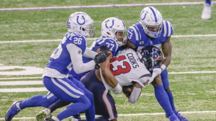 INDIANAPOLIS, IN – DECEMBER 20: Brandin Cooks #13 of the Houston Texans is tackled by a host of Indianapolis Colts defenders during the game at Lucas Oil Stadium on December 20, 2020 in Indianapolis, Indiana. (Photo by Michael Hickey/Getty Images)