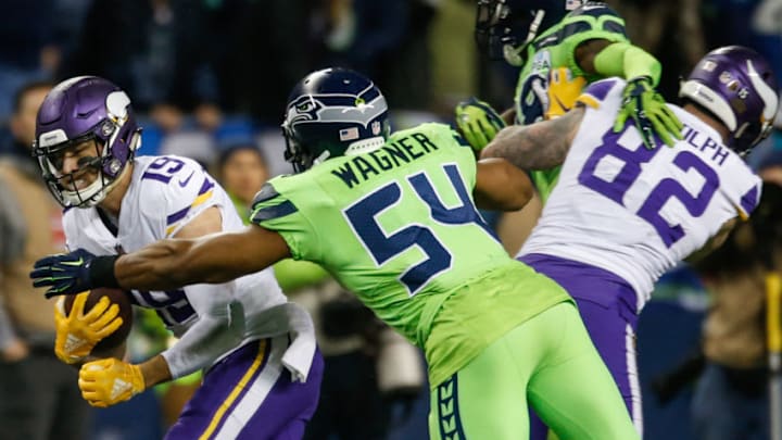 SEATTLE, WA - DECEMBER 10: Bobby Wagner #54 of the Seattle Seahawks tackles Adam Thielen #19 of the Minnesota Vikings in the third quarter at CenturyLink Field on December 10, 2018 in Seattle, Washington. (Photo by Otto Greule Jr/Getty Images)