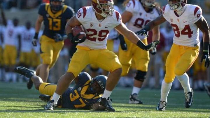 Nov 9, 2013; Berkeley, CA, USA; Southern California Trojans tailback Ty Isaac (29) rushes for a touchdown against the California Golden Bears at Memorial Stadium. USC defeated California 62-28. Mandatory Credit: Kirby Lee-USA TODAY Sports