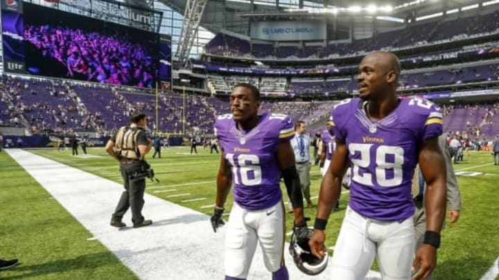 Aug 28, 2016; Minneapolis, MN, USA; Minnesota Vikings wide receiver Terrell Sinkfield (16) and running back Adrian Peterson (28) leave the field after defeating the San Diego Chargers 23-10 at U.S. Bank Stadium. Mandatory Credit: Bruce Kluckhohn-USA TODAY Sports