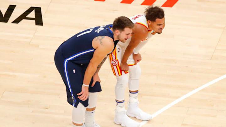 ATLANTA, GA - FEBRUARY 03: Luka Doncic #77 of the Dallas Mavericks speaks with Trae Young #11 of the Atlanta Hawks during the first half at State Farm Arena on February 3, 2021 in Atlanta, Georgia. NOTE TO USER: User expressly acknowledges and agrees that, by downloading and/or using this photograph, user is consenting to the terms and conditions of the Getty Images License Agreement. (Photo by Todd Kirkland/Getty Images)