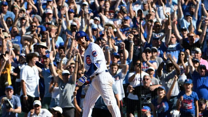 CHICAGO, IL - JULY 08: David Bote #13 of the Chicago Cubs celebrates his game-winning walk in the tenth inning on July 8, 2018 at Wrigley Field in Chicago, Illinois. The Cubs won 6-5 in ten innings. (Photo by David Banks/Getty Images)