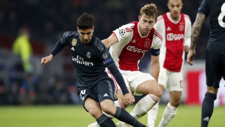 (l-r) Marco Asensio of Real Madrid, Matthijs de Ligt of Ajax during the UEFA Champions League round of 16 match Ajax Amsterdam and Real Madrid at the Johan Cruijff Arena on February 13, 2019 in Amsterdam, The Netherlands(Photo by VI Images via Getty Images)