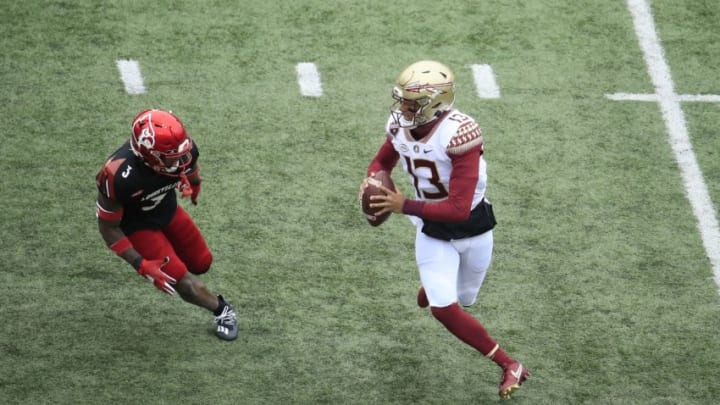 LOUISVILLE, KENTUCKY - OCTOBER 24: Jordan Travis #13 of the Florida State Seminoles runs with the ball against the Louisville Cardinals at Cardinal Stadium on October 24, 2020 in Louisville, Kentucky. (Photo by Andy Lyons/Getty Images)