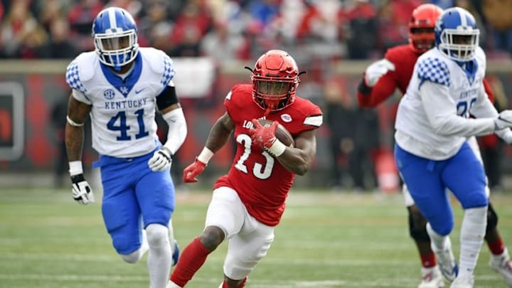 Nov 26, 2016; Louisville, KY, USA; Louisville Cardinals running back Brandon Radcliff (23) runs the ball past Kentucky Wildcats linebacker Josh Allen (41) during the second quarter at Papa John
