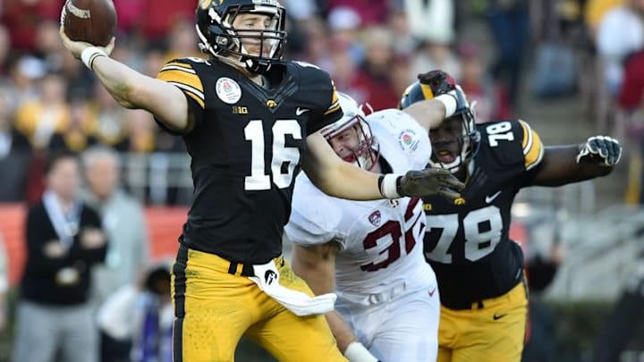 Jan 1, 2016; Pasadena, CA, USA; Iowa Hawkeyes quarterback C.J. Beathard (16) throws under pressure from Stanford Cardinal linebacker Joey Alfieri (32) during the third quarter in the 2016 Rose Bowl at Rose Bowl. Mandatory Credit: Kirby Lee-USA TODAY Sports