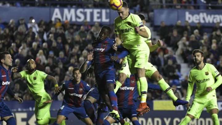 Levante's Ghanaian forward Emmanuel Boateng (4L) vies with Barcelona's Dutch defender Thomas Vermaelen during the Spanish League football match between Levante and Barcelona at the Ciutat de Valencia stadium in Valencia on December 16, 2018. (Photo by JOSE JORDAN / AFP) (Photo credit should read JOSE JORDAN/AFP/Getty Images)