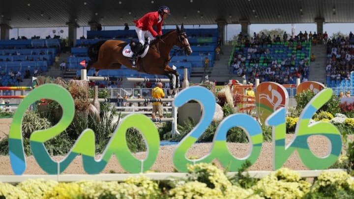 Aug 17, 2016; Rio de Janeiro, Brazil; Eric Lamaze (CAN) rides fine lady 5 during jumping qualification in the Rio 2016 Summer Olympic Games at Olympic Equestrian Centre. Mandatory Credit: Matt Kryger-USA TODAY Sports