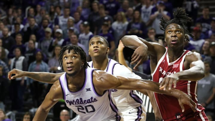 Jan 29, 2020; Manhattan, Kansas, USA; Oklahoma Sooners forward Victor Iwuakor (0) and Kansas State Wildcats forward Zavier Sneed (20) and guard DaJuan Gordon (3) fight for a rebound during the second half of a game at Bramlage Coliseum. Mandatory Credit: Scott Sewell-USA TODAY Sports
