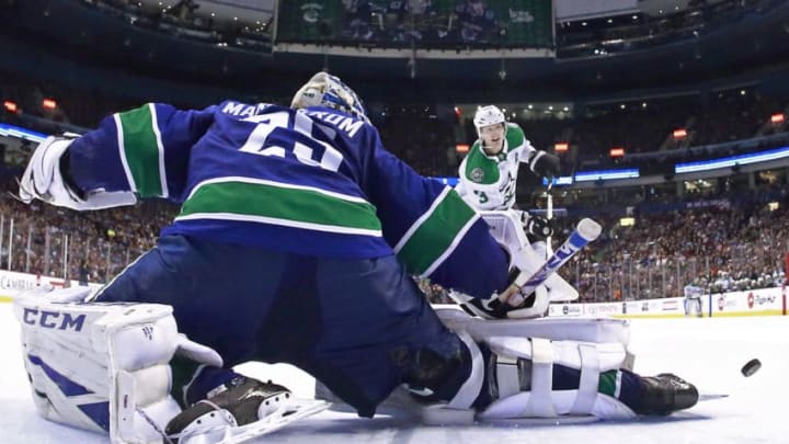 VANCOUVER, BC - MARCH 30: Jacob Markstrom #25 of the Vancouver Canucks makes a save on John Klingberg #3 of the Dallas Stars during their NHL game at Rogers Arena March 30, 2019 in Vancouver, British Columbia, Canada. (Photo by Jeff Vinnick/NHLI via Getty Images)"n