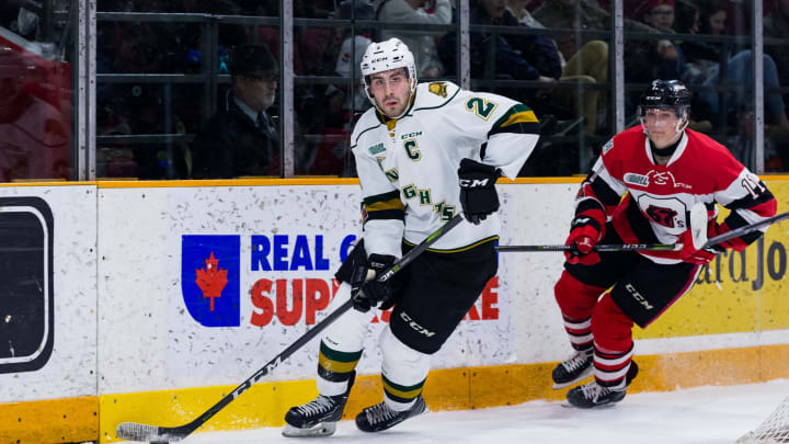 OTTAWA, ON – MARCH 04: London Knights Defenceman Evan Bouchard (2) skates the puck out from behind the net chased by Ottawa 67’s Forward Seva Losev (11) during Ontario Hockey League action between the London Knights and Ottawa 67’s on March 4, 2018, at TD Place Arena in Ottawa, ON, Canada. (Photo by Richard A. Whittaker/Icon Sportswire via Getty Images)