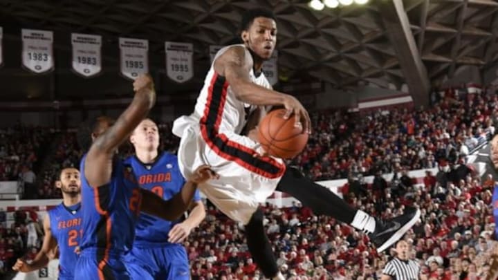Jan 17, 2015; Athens, GA, USA; Georgia Bulldogs guard Charles Mann (4) passes against Florida Gators guard Michael Frazier II (20) during the second half at Stegeman Coliseum. Georgia defeated Florida 73-61. Mandatory Credit: Dale Zanine-USA TODAY Sports