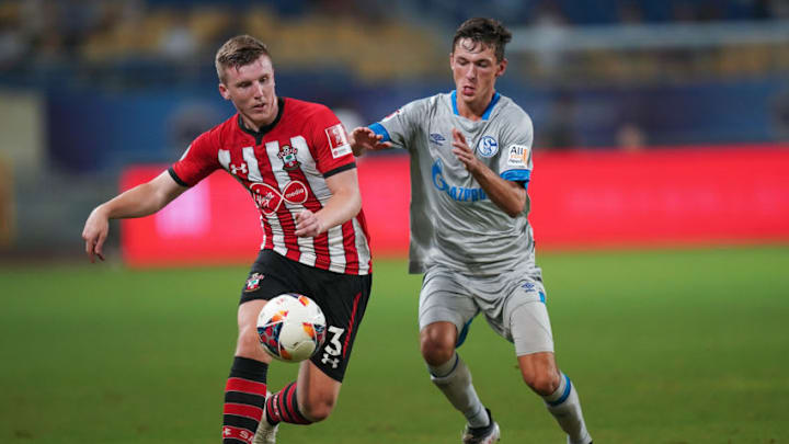 KUNSHAN, CHINA - JULY 05: Benjamin Goller of Schalke FC competes for the ball against Matthew Targett of Southampton FC during the 2018 Clubs Super Cup match between Schalke and Southampton at Kunshan Sports Center Stadium on July 5, 2018 in Kunshan, Jiangsu Provinceon, China. (Photo by Lintao Zhang/Getty Images)