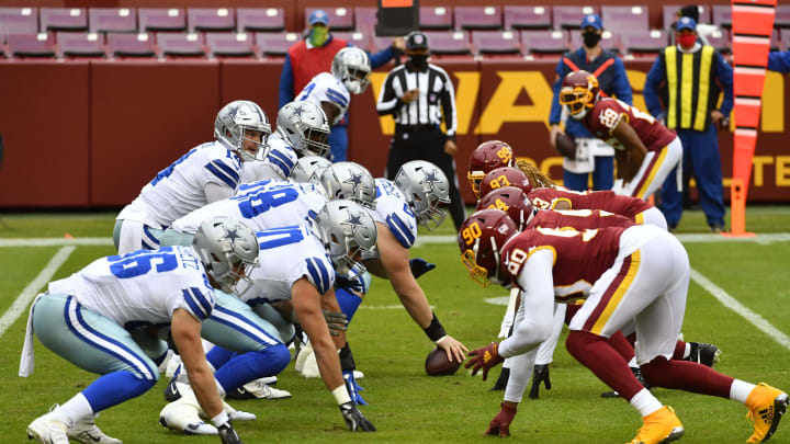 Oct 25, 2020; Landover, Maryland, USA; Dallas Cowboys and Washington Football Team at the line of scrimmage during the first quarter at FedExField. Mandatory Credit: Brad Mills-USA TODAY Sports